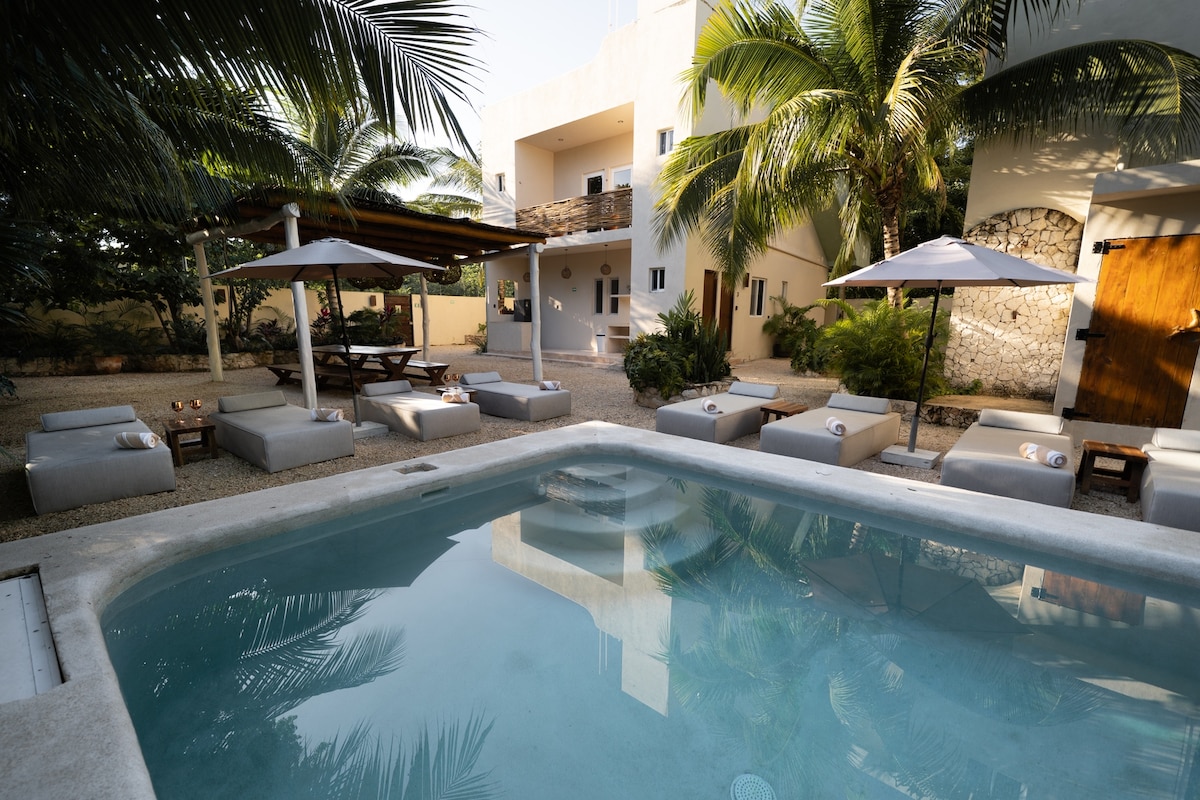 Private pool with sun loungers and umbrellas