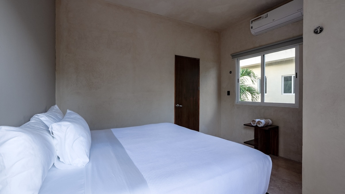Bedroom with king bed and air conditioning