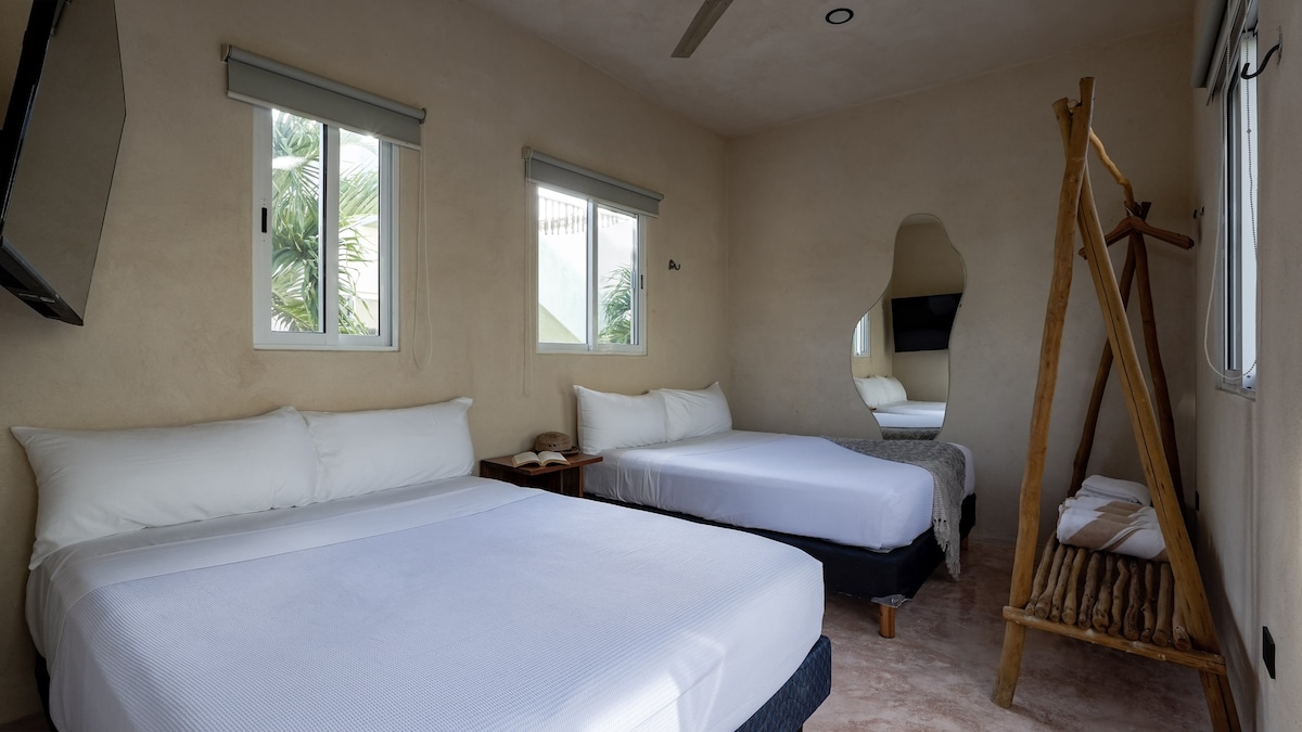 Bedroom with two beds and a Smart TV